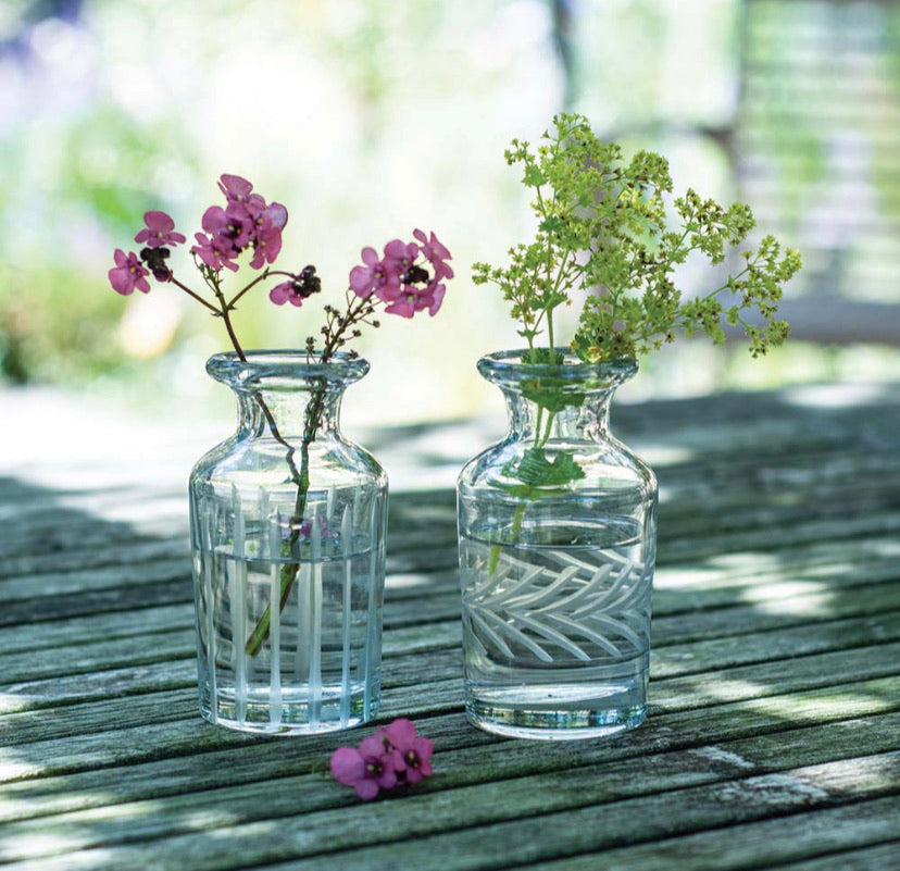 A pair of etched glass vases.